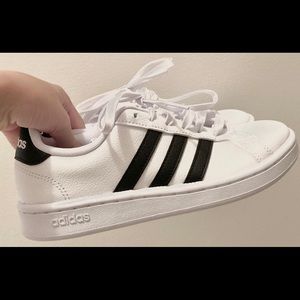 Size 5 1/2 (US) white adidas with black stripes
